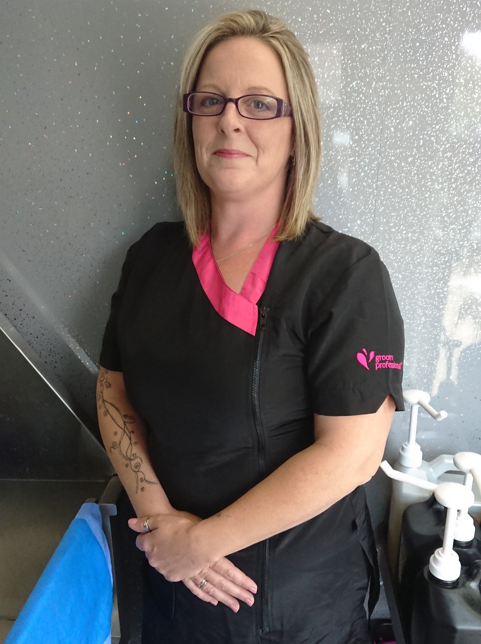 Sonia Marshall in her grooming tunic in the salon